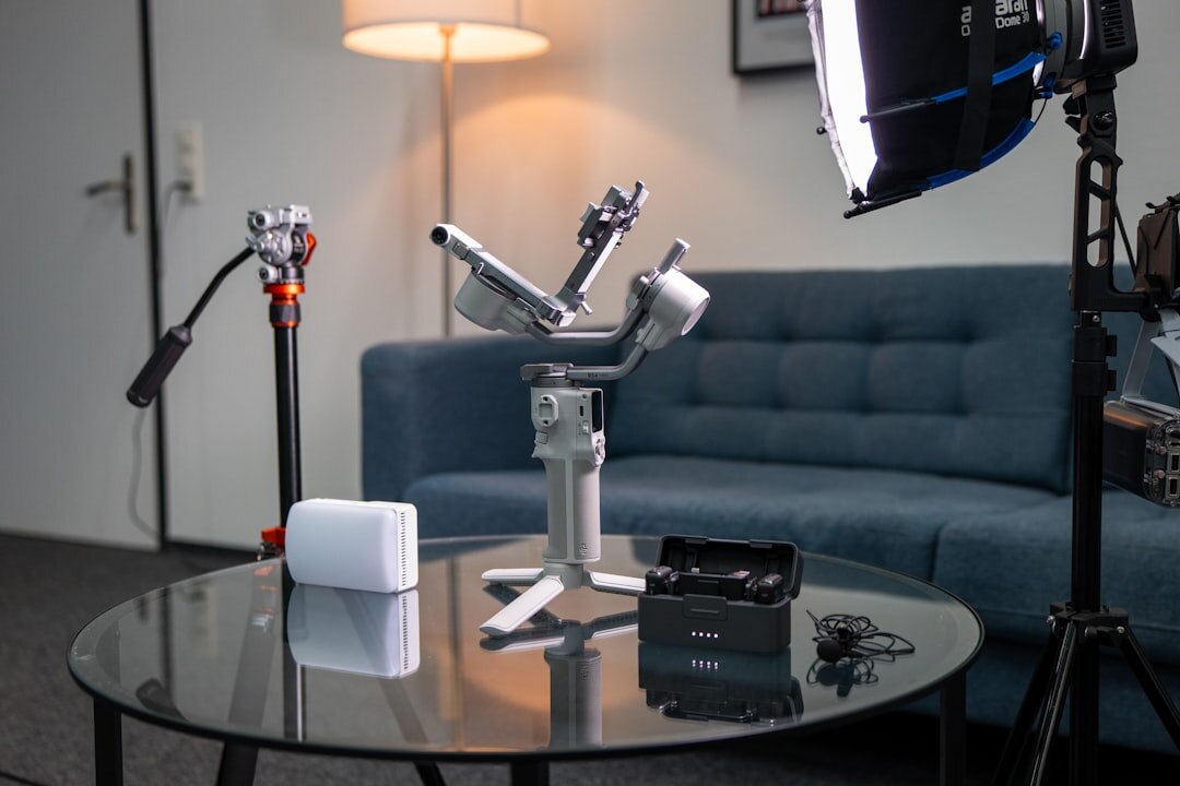 Professional broadcast camera on tripod in studio with lighting