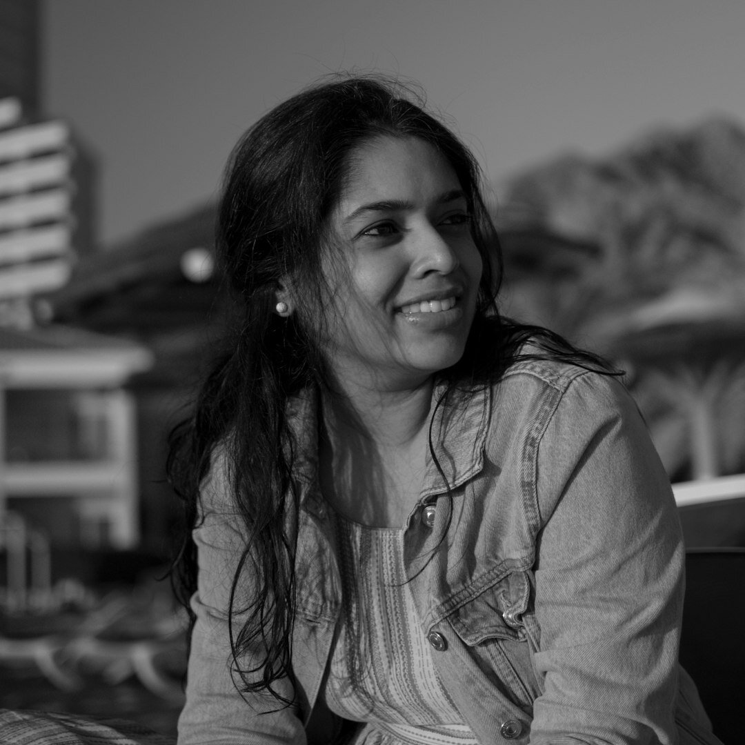 Smiling Turkish female journalism graduate in professional setting